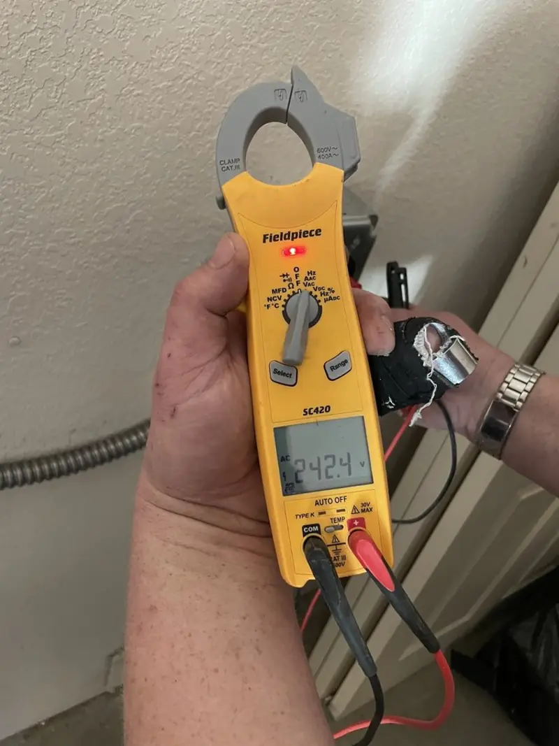 Voltage testing with clamp meter during Electrical Installation Services in Fort Lauderdale